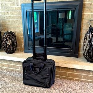 Tumi mens black canvas rolling carry on bag with retractable hidden handle EUC